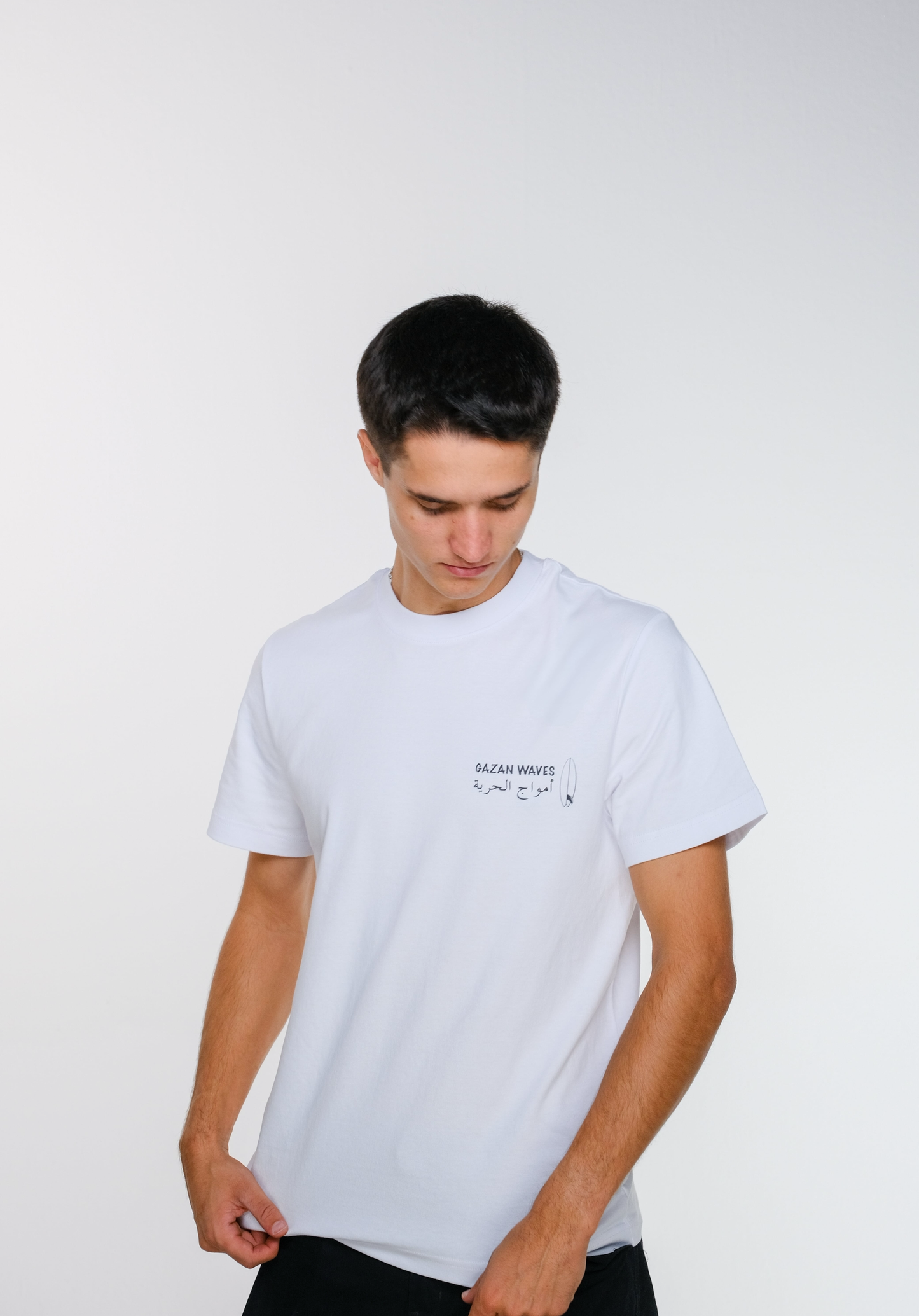 Angled front view of the model showcasing the t-shirt’s texture and soft fabric while wearing the t-shirt — highlighting quality and comfort.