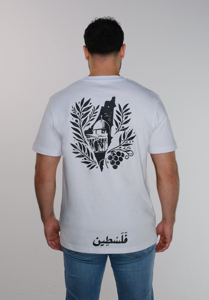 A model wearing the T-shirt from the back, showcasing a stylized map of Palestine framing Al-Aqsa Mosque, surrounded by olive leaves, with a grape cluster on the right side and "فلسطين" written in Arabic at the bottom which mean "Palestine".
