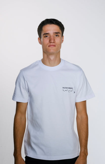 Model wearing the Gaza Surf Club t-shirt facing forward, showing the small front design. Casual, loose fit reflecting streetwear style and coastal vibes.