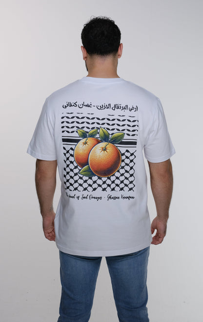 Model showing the back of the Ghassan Kanafani t-shirt with the prominent square design combining the Palestinian keffiyeh and poetic calligraphy.